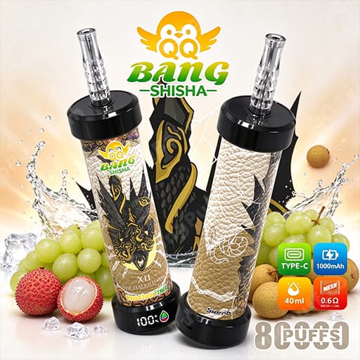Two Bang Shisha electronic vaping devices with black caps, ornate gold-and-cream patterned sleeves, and clear glass bodies with metal mouthpieces, displayed among grapes and lychee with the Bang Shisha logo above.